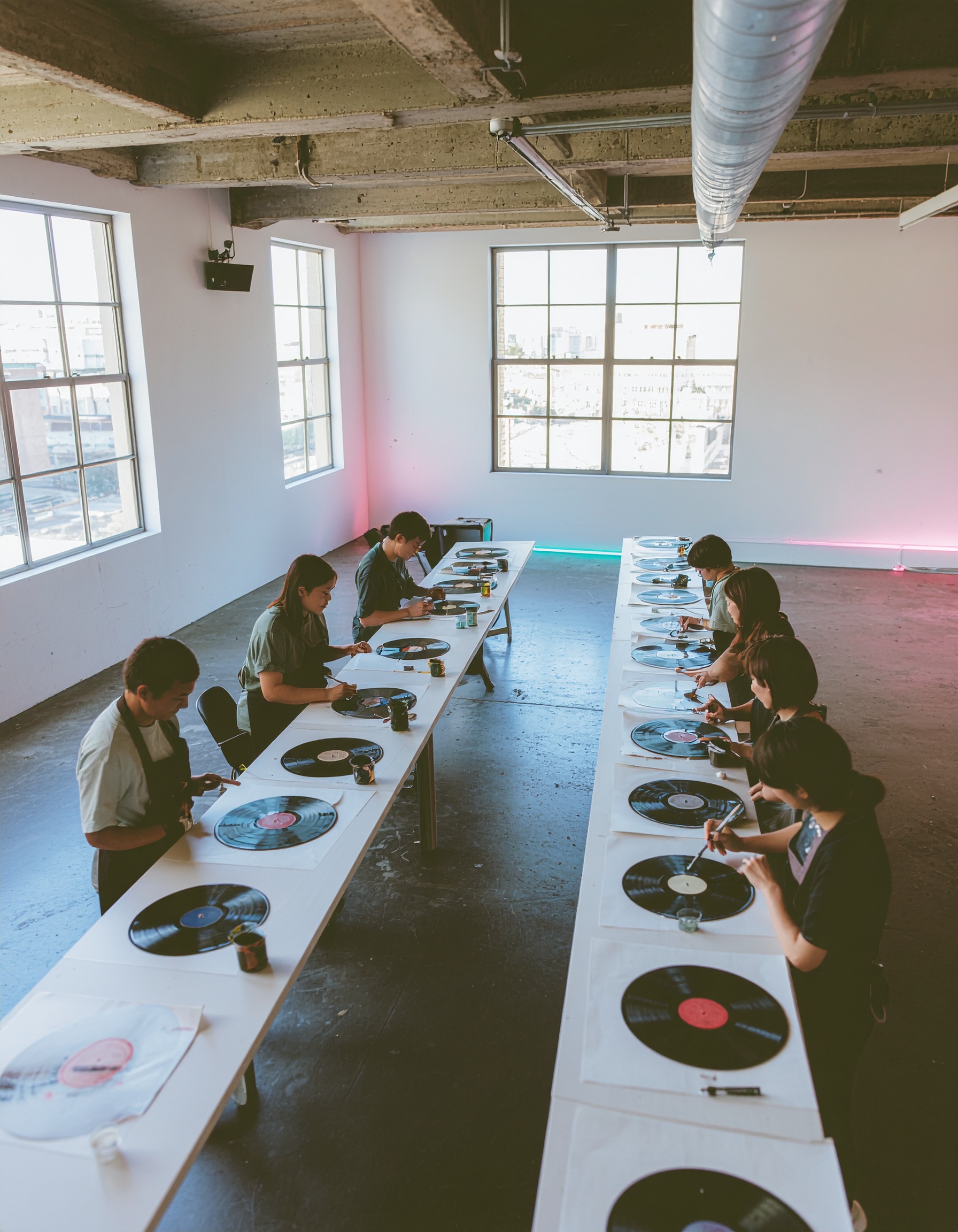 Firefly_4-3 photo, high angle semi-bird’s-eye view of entire Art Disco workshop. Long tables 907348